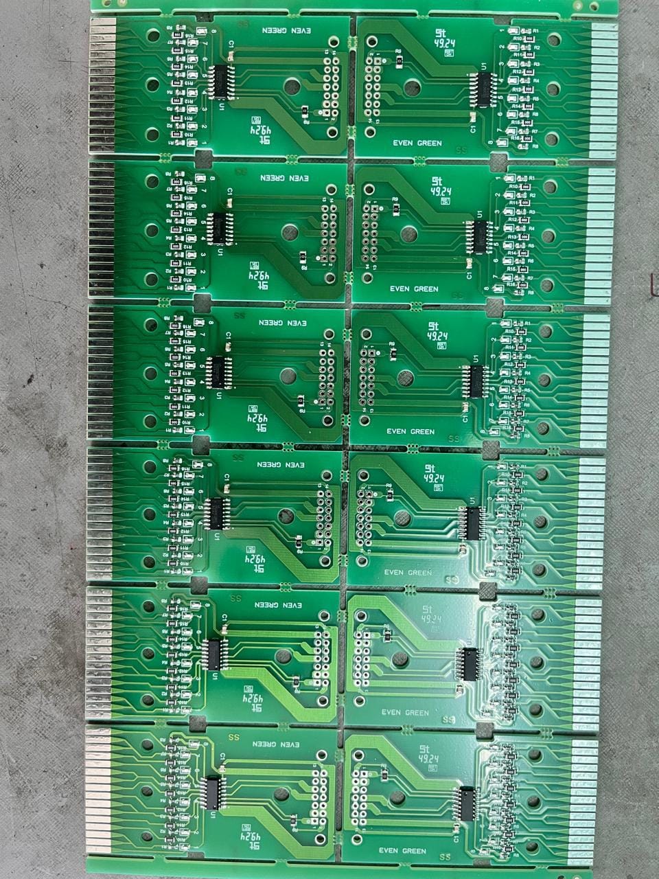 Panel of populated green eJacq hook driver boards marked EVEN GREEN, with gold-finger edge connectors