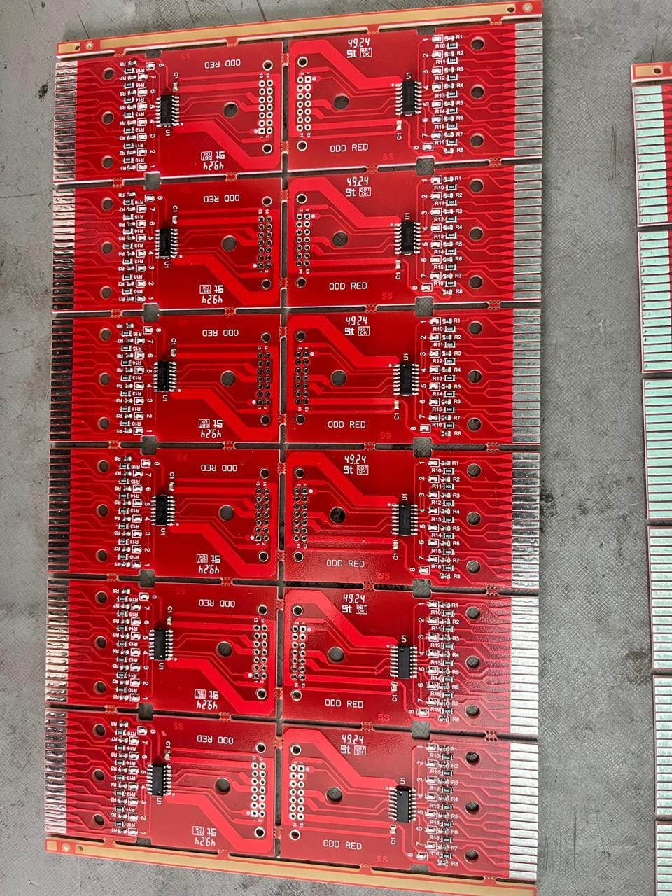Panel of populated red eJacq hook driver boards marked ODD RED, with gold-finger edge connectors