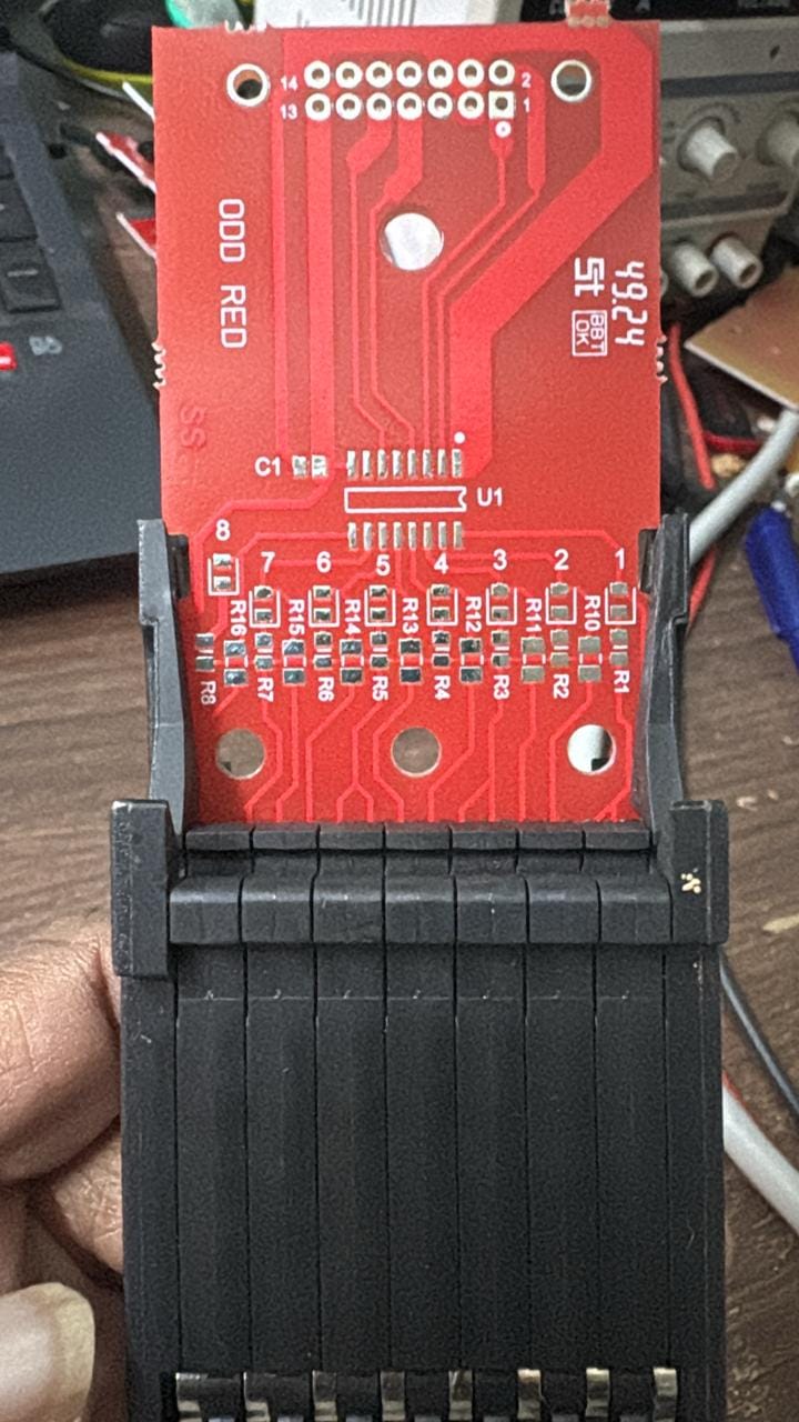 Single eJacq hook driver board seated in its black connector block on the loom