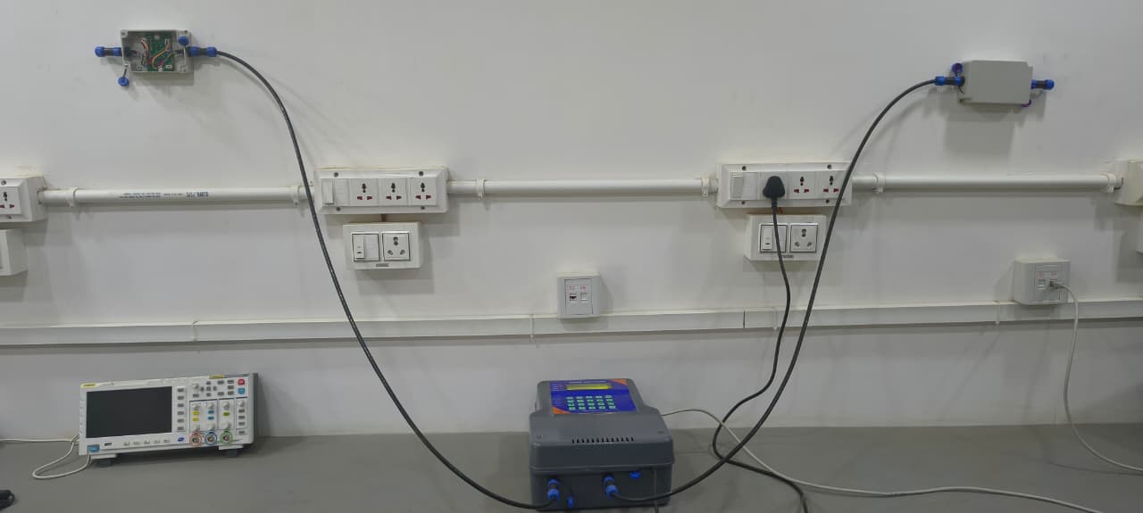 Prachir system on test: two N100 nodes wired to an M100 master controller, one node opened to show the board